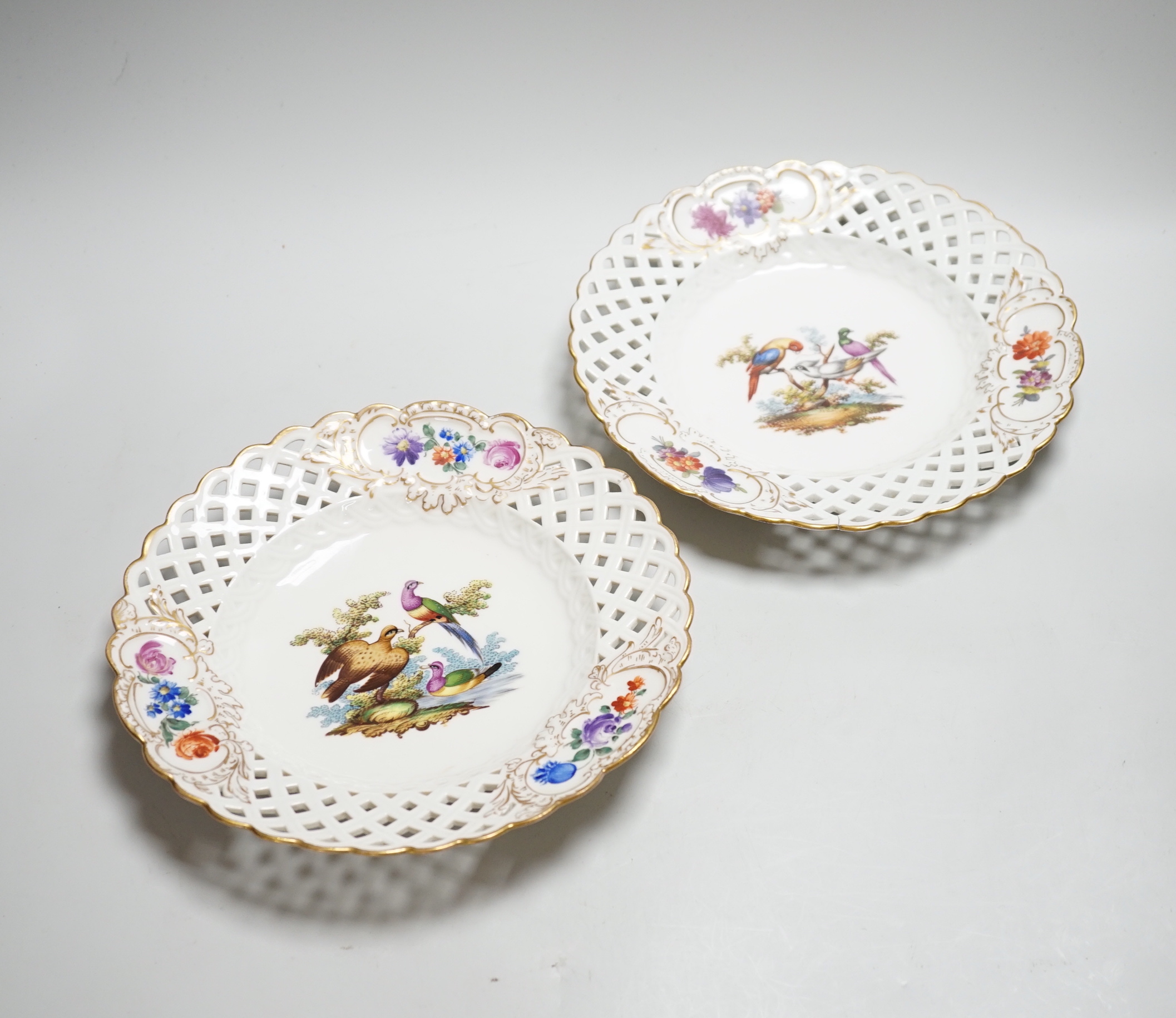 A pair of Meissen outside-decorated bird and flower dishes, 23cm diameter